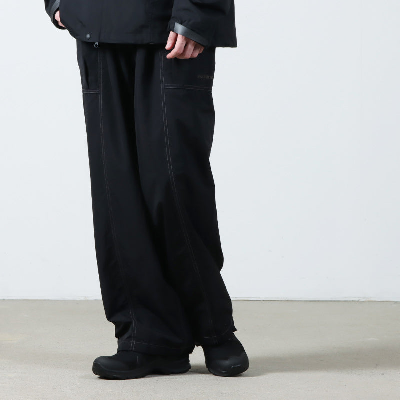 and wander(アンドワンダー) crinkled nylon pants